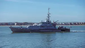 A UK Border Force vessel patrolling coastal waters near the British coastline.