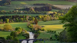 Panoramic view over the green Tweed valley in the Scottish Borders landscape.