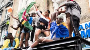 Crowd celebrating at Notting Hill Carnival on a street in London