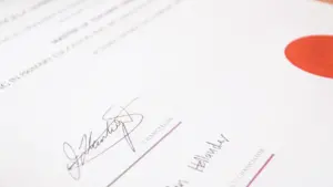 Close-up of a signed official document representing a formal partnership agreement.