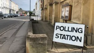 A clear Polling Station sign situated on a street in the UK.