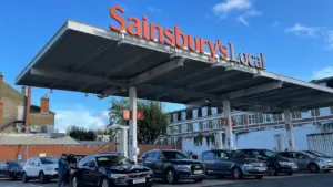 Cars queueing at a UK petrol station during a fuel supply shortage.