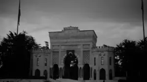 Grand historic stone building with a statue, suitable for educational institutional news.
