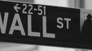 Black and white street sign for Wall Street in New York City
