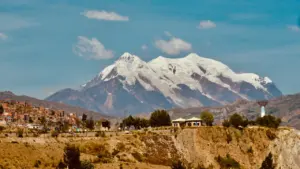 The snow-capped Illimani mountain towering over the city of La Paz, Bolivia.